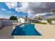 Inviting pool with a clean, modern design in a spacious backyard setting at 405 E Cornell Dr, Tempe, AZ 85283