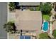 Overhead aerial view showcasing the home's roof, landscaped backyard with pool, and surrounding neighborhood at 420 S Dodge Dr, Chandler, AZ 85225