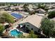 Overhead aerial view showing a pool, landscaped backyard, and the home's rooftop and solar panels at 420 S Dodge Dr, Chandler, AZ 85225