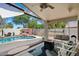 Inviting backyard with pool, covered patio, hanging swing, fire pit, and outdoor seating area at 420 S Dodge Dr, Chandler, AZ 85225