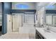 Bright bathroom with a glass shower, soaking tub, and a vanity with a contemporary design, perfect for relaxation at 420 S Dodge Dr, Chandler, AZ 85225