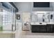 Modern bathroom with a glass block shower, soaking tub, dual sinks, and sleek cabinets, offering a spa-like experience at 420 S Dodge Dr, Chandler, AZ 85225