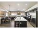 Spacious, modern kitchen featuring an eat-in island, stainless steel appliances, and an open floorplan at 420 S Dodge Dr, Chandler, AZ 85225