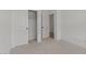 Neutral carpeted bedroom with walk in closet and light filled interior at 42405 W Peters Dr, Maricopa, AZ 85138