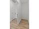 Hallway featuring wood-look floors that transition to other rooms in the home at 42405 W Peters Dr, Maricopa, AZ 85138
