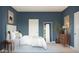 Comfortable bedroom featuring a cozy bed, bedside tables, ample natural light, and tranquil decor at 42405 W Peters Dr, Maricopa, AZ 85138