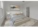 Bedroom features an elegant bed, soft lighting, and a serene atmosphere at 42405 W Peters Dr, Maricopa, AZ 85138