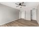 Comfortable bedroom with hardwood floors and a closet at 4610 N 68Th St # 409, Scottsdale, AZ 85251