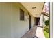 Close-up of an apartment entrance with a security door and window with blinds at 4610 N 68Th St # 409, Scottsdale, AZ 85251