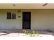 Apartment entrance featuring a window with blinds and security screen door at 4610 N 68Th St # 409, Scottsdale, AZ 85251