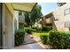 Apartment complex with well-manicured landscaping and mature trees at 4610 N 68Th St # 409, Scottsdale, AZ 85251