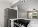 Modern kitchen features stainless steel appliances and white countertops with an adjacent living area at 4610 N 68Th St # 409, Scottsdale, AZ 85251