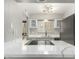 Modern kitchen featuring white marble countertops and stainless-steel appliances at 4610 N 68Th St # 409, Scottsdale, AZ 85251