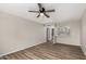 Bright, empty living room featuring wood floors and an open kitchen area at 4610 N 68Th St # 409, Scottsdale, AZ 85251