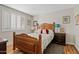 Bright bedroom featuring a wooden bed frame, plush pillows, and natural light from the window at 4613 E Shangri La Rd --, Phoenix, AZ 85028