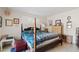 Charming bedroom with a four-poster bed and bright, patterned bedding with tiled flooring at 4613 E Shangri La Rd --, Phoenix, AZ 85028