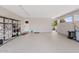 Clean and spacious garage with epoxy floors and metal shelving for storage at 4613 E Shangri La Rd --, Phoenix, AZ 85028
