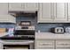 Modern kitchen with stainless steel appliances and a sleek countertop at 4613 E Shangri La Rd --, Phoenix, AZ 85028