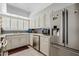 Well-equipped kitchen with stainless steel appliances, a refrigerator, and white cabinets at 4613 E Shangri La Rd --, Phoenix, AZ 85028