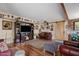 Cozy living room with a large TV, wooden accents, comfortable seating, and a sliding barn door at 4613 E Shangri La Rd --, Phoenix, AZ 85028