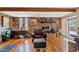 Inviting living room showcases a brick fireplace, wooden beams, and ample seating, perfect for relaxation at 4613 E Shangri La Rd --, Phoenix, AZ 85028