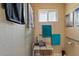 Accessible shower with grab bars, seating, and refreshing turquoise towels at 4613 E Shangri La Rd --, Phoenix, AZ 85028