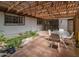 Inviting back patio with brick flooring, pergola, koi pond, and seating area at 4620 N 38Th Dr, Phoenix, AZ 85019