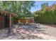 Private backyard with mature trees, shaded seating area, and well-maintained landscaping at 4620 N 38Th Dr, Phoenix, AZ 85019