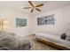 Cozy bedroom with a full sized bed, ceiling fan, and patterned wallpaper at 4620 N 38Th Dr, Phoenix, AZ 85019