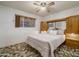 Bedroom with a bed, retro-style built-in cabinetry, and a ceiling fan at 4620 N 38Th Dr, Phoenix, AZ 85019