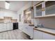 Bright kitchen with white cabinetry, modern appliances, and built-in counter space at 4620 N 38Th Dr, Phoenix, AZ 85019