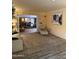 Spacious living room with neutral carpet, natural light, and decorative shelving at 4620 N 38Th Dr, Phoenix, AZ 85019