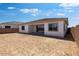 View of the home's backyard, offering a blank canvas for landscaping and outdoor living at 5311 N 88Th Ave, Glendale, AZ 85305