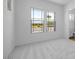 Bright bedroom with natural light, neutral carpeting, and two large windows at 5311 N 88Th Ave, Glendale, AZ 85305