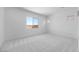A clean and well-lit bedroom with neutral tones, carpet flooring and a good size window at 5311 N 88Th Ave, Glendale, AZ 85305