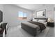 Bright bedroom featuring a comfortable bed, stylish decor, and a large window offering ample natural light at 5311 N 88Th Ave, Glendale, AZ 85305