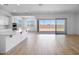 Modern kitchen with a large island, sleek countertops, stainless steel appliances, and a view of the backyard at 5311 N 88Th Ave, Glendale, AZ 85305