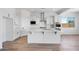 Spacious kitchen with a center island, stainless steel appliances, and sleek white cabinets at 5311 N 88Th Ave, Glendale, AZ 85305