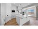 Open kitchen showcasing a large center island, stainless appliances, and ample counter space at 5311 N 88Th Ave, Glendale, AZ 85305