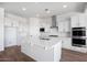 Well-equipped kitchen with stainless steel appliances, center island and white cabinetry at 5311 N 88Th Ave, Glendale, AZ 85305