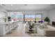 Open-concept living space showcasing a kitchen island, dining area, and a stylishly furnished living room at 5311 N 88Th Ave, Glendale, AZ 85305