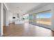 Open floor plan with hardwood floors, large sliding glass doors, connecting the living area to the outdoors at 5311 N 88Th Ave, Glendale, AZ 85305
