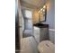 Bathroom with white marble floors, vessel sink, modern vanity, and views into the bedroom at 5815 N 21St Ave, Phoenix, AZ 85015