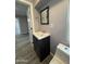 Cozy bathroom with a modern sink and mirror, and clean gray walls at 5815 N 21St Ave, Phoenix, AZ 85015