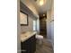 Updated bathroom featuring stylish vanity, toilet, decorative mirror and tiled shower at 5815 N 21St Ave, Phoenix, AZ 85015