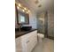 Bathroom with a vessel sink, modern vanity, tiled shower, and contemporary fixtures at 5815 N 21St Ave, Phoenix, AZ 85015