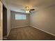 Bedroom featuring a ceiling fan, window, and carpeted floor at 5815 N 21St Ave, Phoenix, AZ 85015