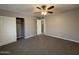 This bedroom has neutral walls, carpet, a closet and a ceiling fan with light fixture at 5815 N 21St Ave, Phoenix, AZ 85015