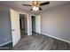 Bedroom with hard flooring, open doors, and gray walls at 5815 N 21St Ave, Phoenix, AZ 85015