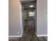 Hallway showcases modern wood-look tile flooring, neutral paint, and a well-lit space at 5815 N 21St Ave, Phoenix, AZ 85015
